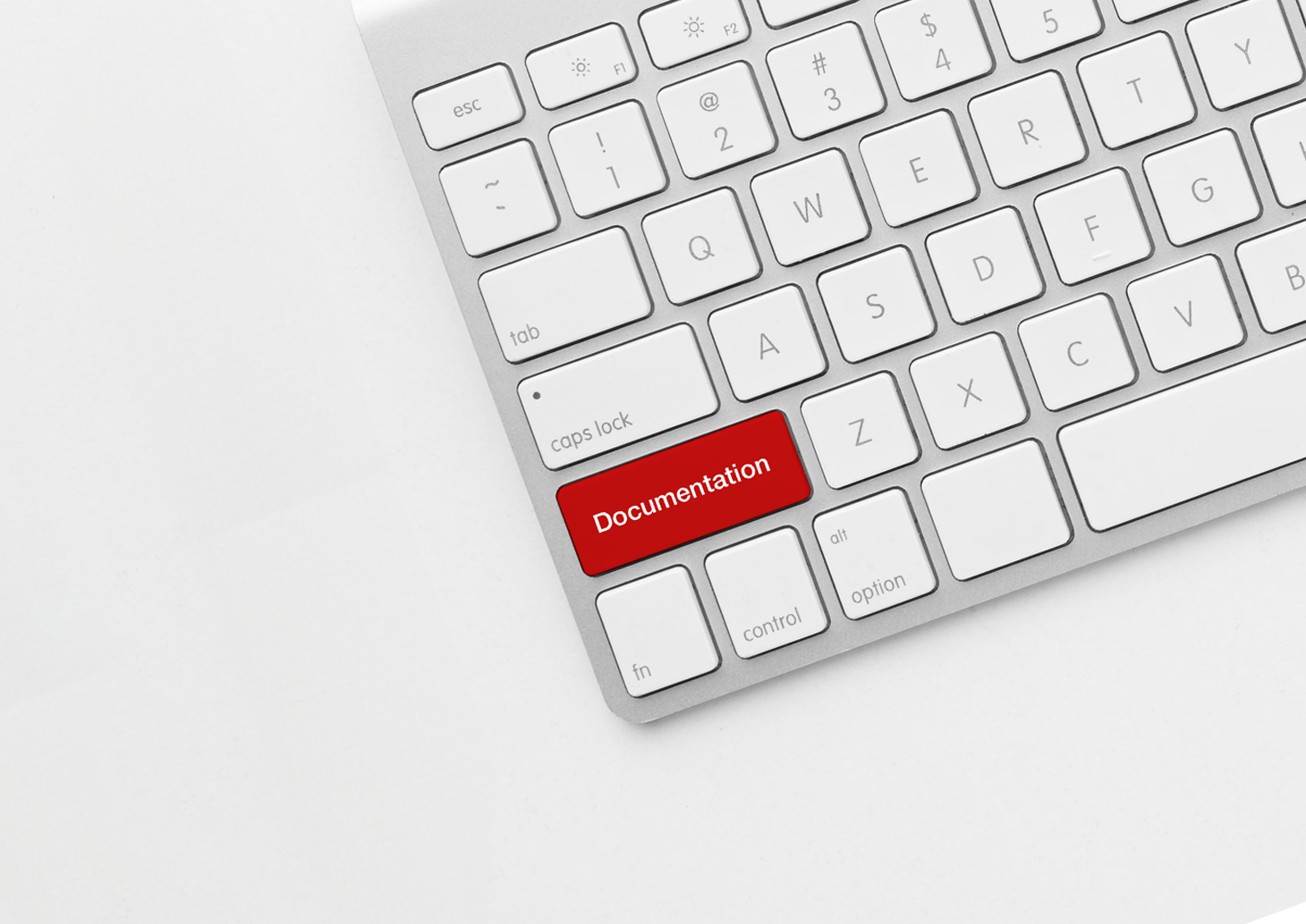 A white keyboard with one red button that says documentation.