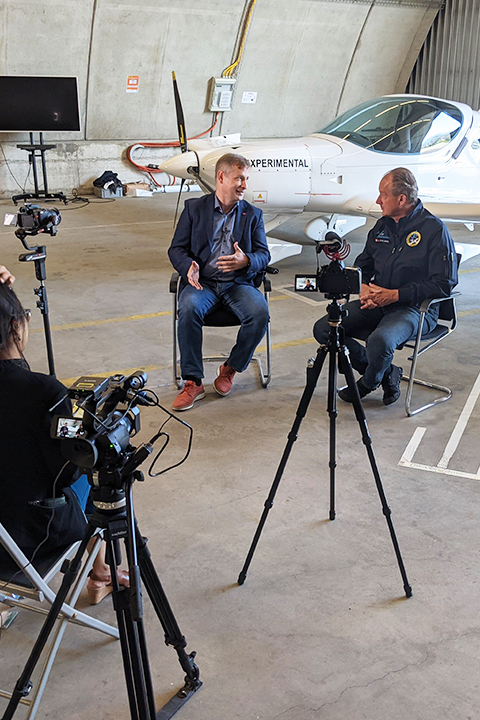 An interview setup in the airplane garage.