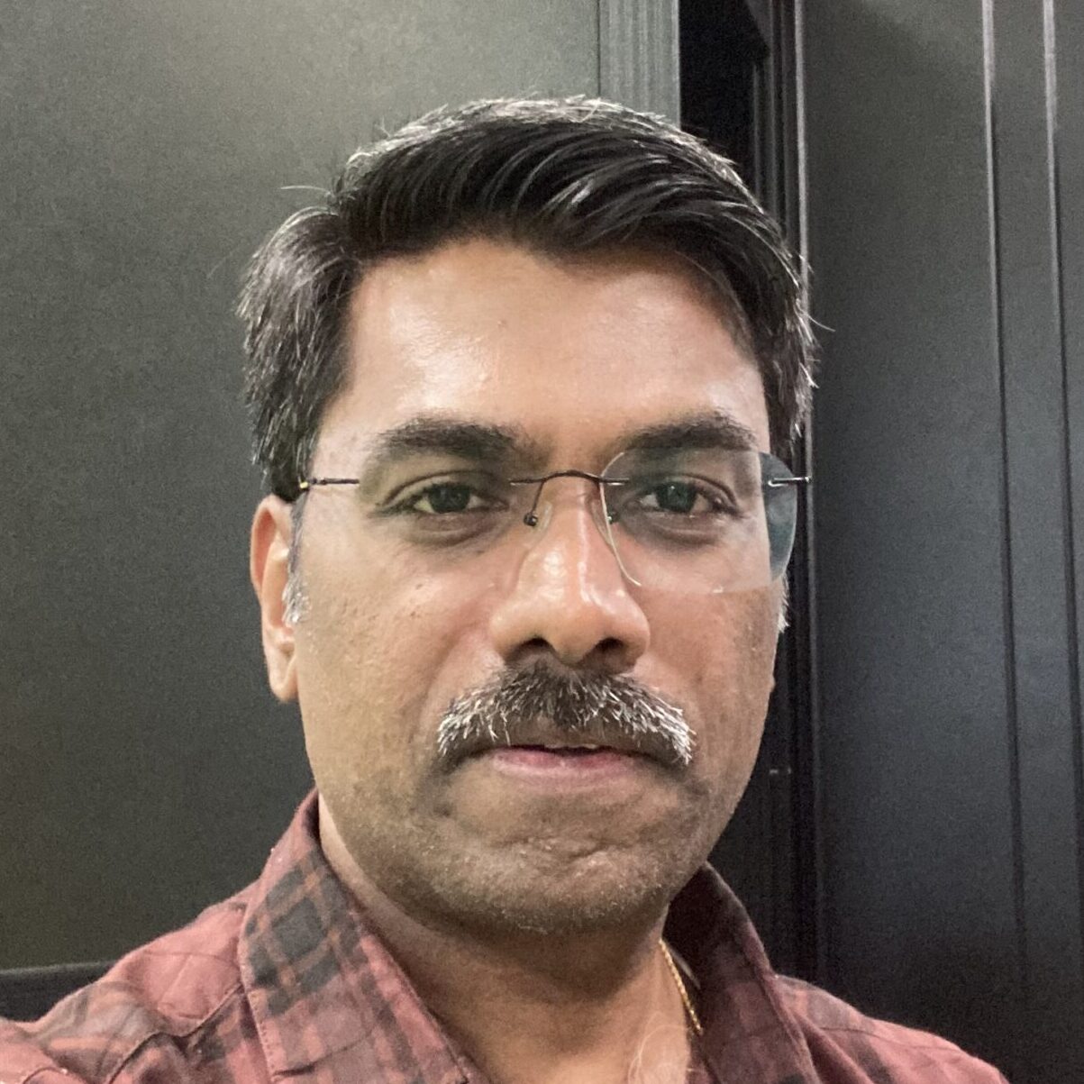 A head shot of Sivamani Kukunuri.