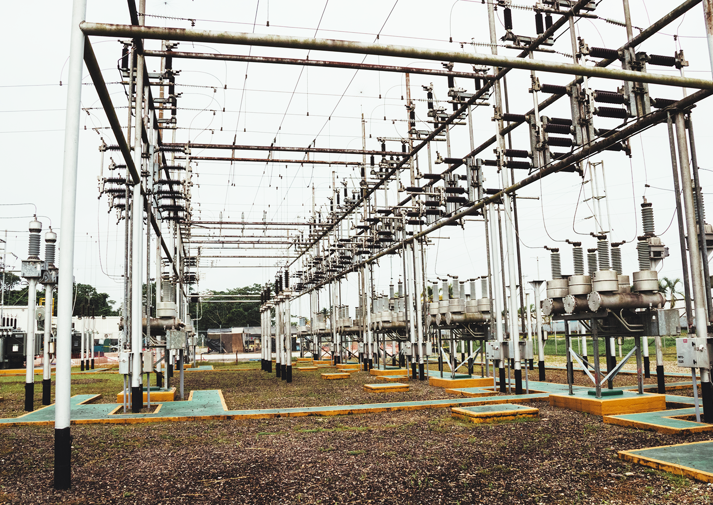 A sprawling electrical substation with numerous wires and poles, serving as a vital hub for power distribution.